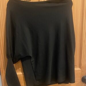 Batwing top with boat neck . Dress up or down ! Highly flattering neckline